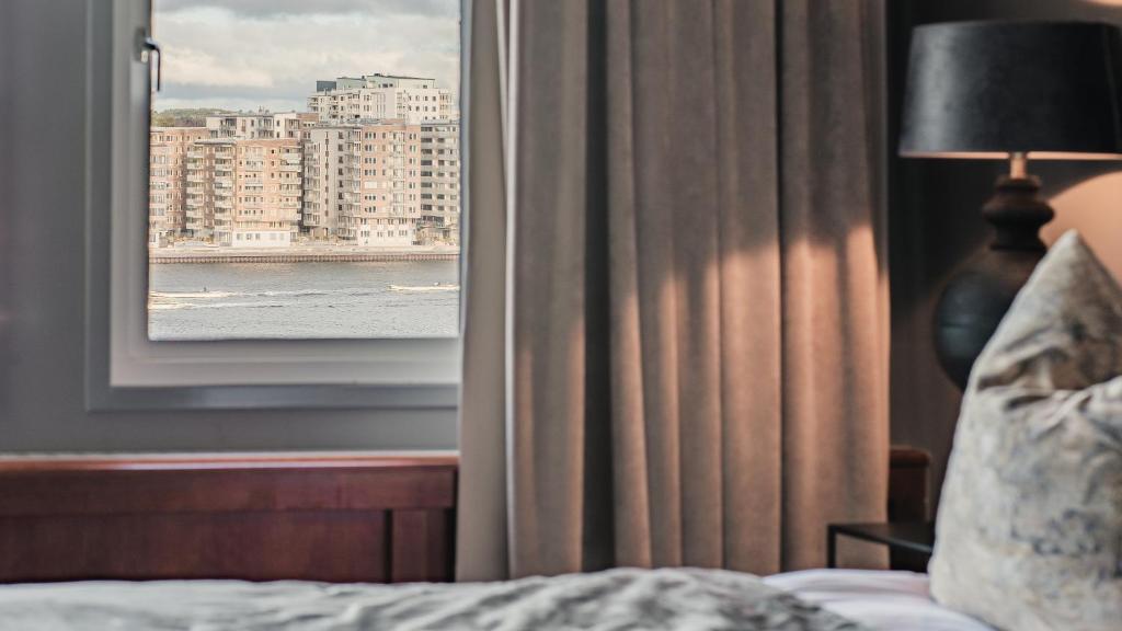 Postel nebo postele na pokoji v ubytování Quality Hotel Waterfront