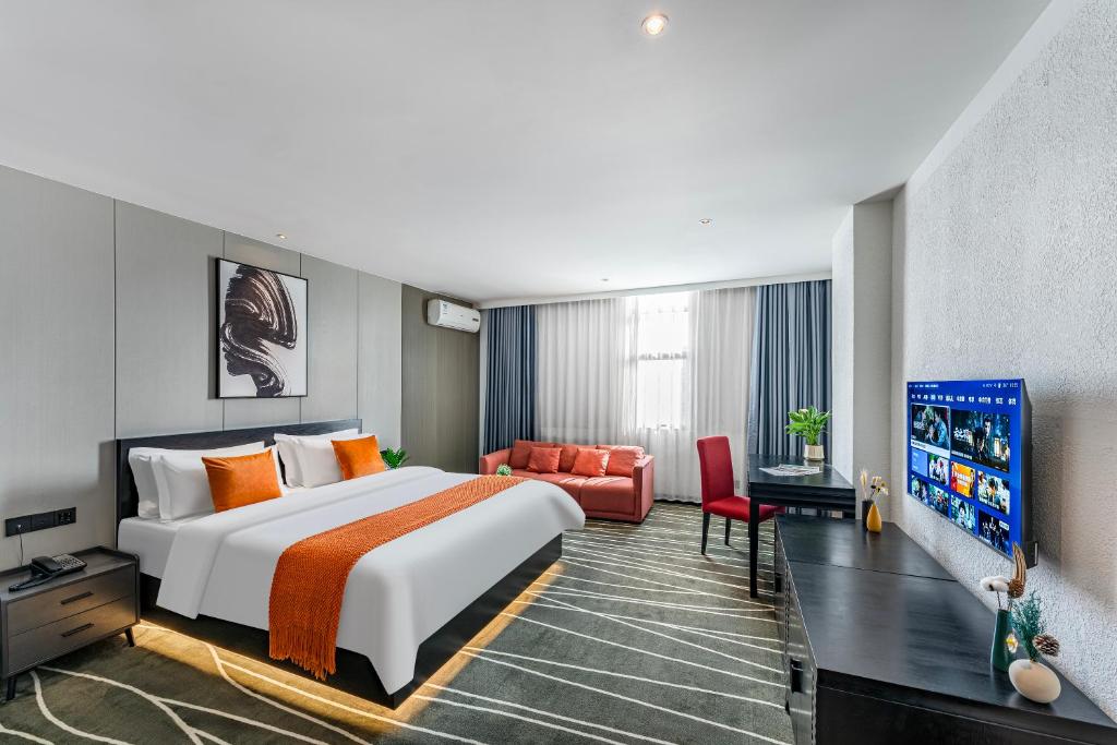 Postel nebo postele na pokoji v ubytování Boyue Miyazaki Hotel - Guangzhou Baiyun International Airport