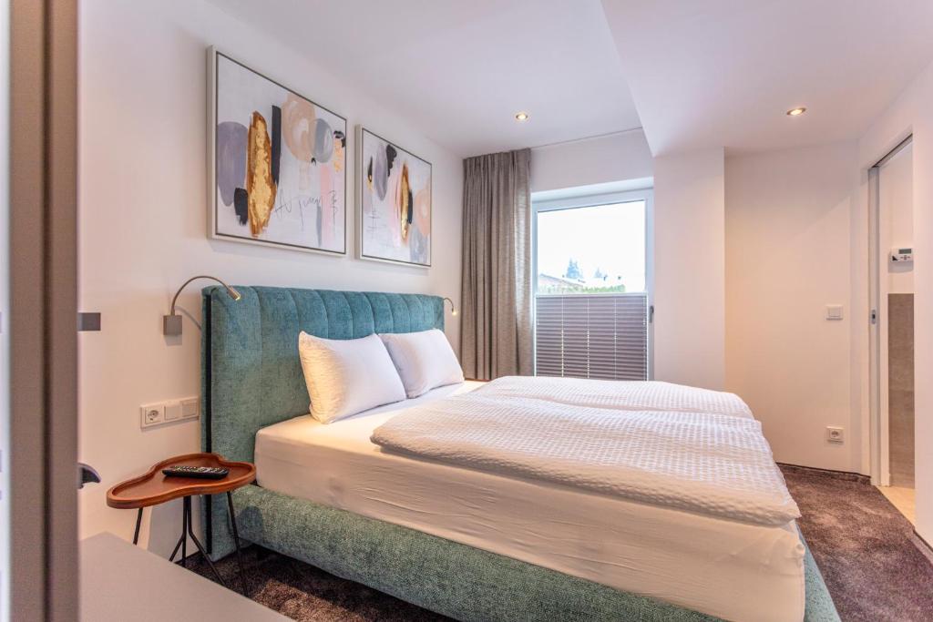 Postel nebo postele na pokoji v ubytování lechner living apartments