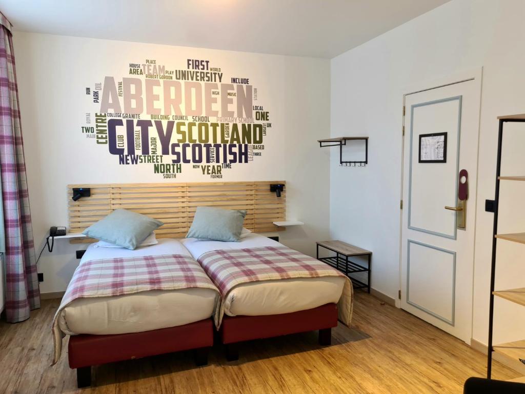 Postel nebo postele na pokoji v ubytování Hotel La Roseraie