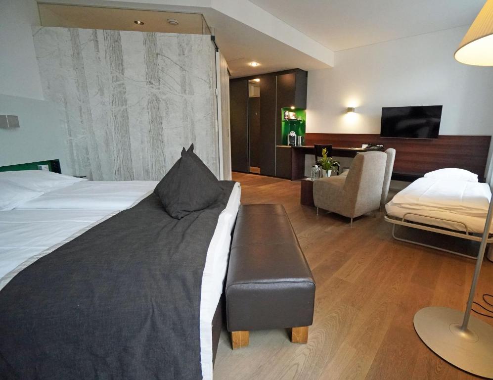 Postel nebo postele na pokoji v ubytování Hotel Glockenhof Zürich