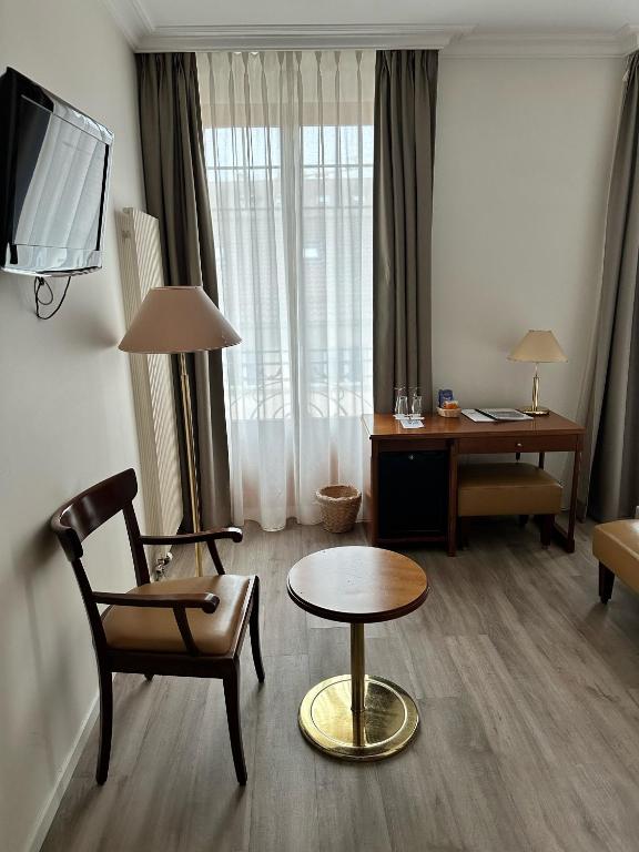Posezení v ubytování Hôtel des Alpes
