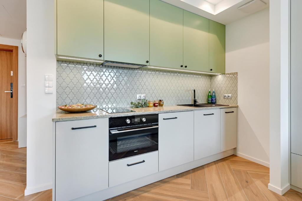 Kuchyňa alebo kuchynka v ubytovaní Rent like home - Apartamenty DEO PLAZA