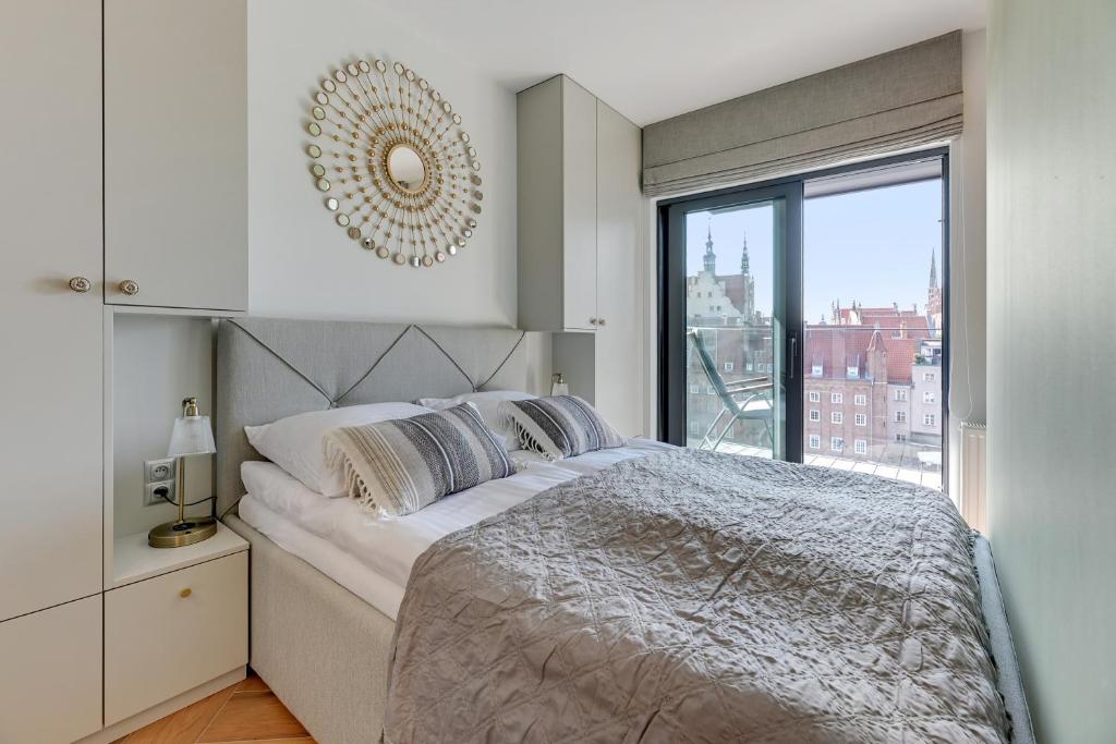 Posteľ alebo postele v izbe v ubytovaní Rent like home - Apartamenty DEO PLAZA