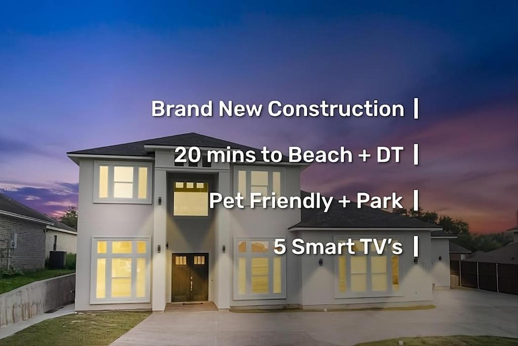 a house with the words brand new construction and mins to beach dri at Newly Built Stylish Retreat with Designer Kitchen - Near Park & Beach in Corpus Christi