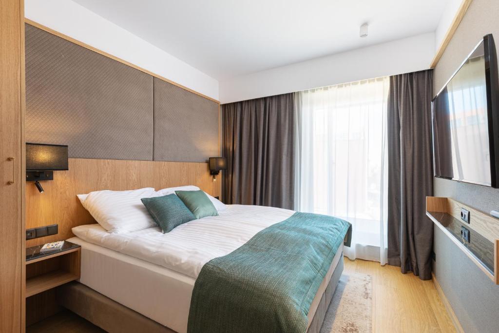 Posteľ alebo postele v izbe v ubytovaní Rent like home - Apartamenty DEO PLAZA