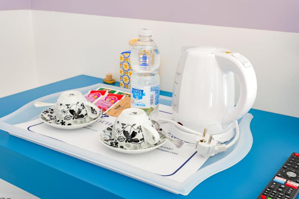 a tray with twoacersacers at Villa Caravaggio Comfort e Relax in Rocca San Giovanni