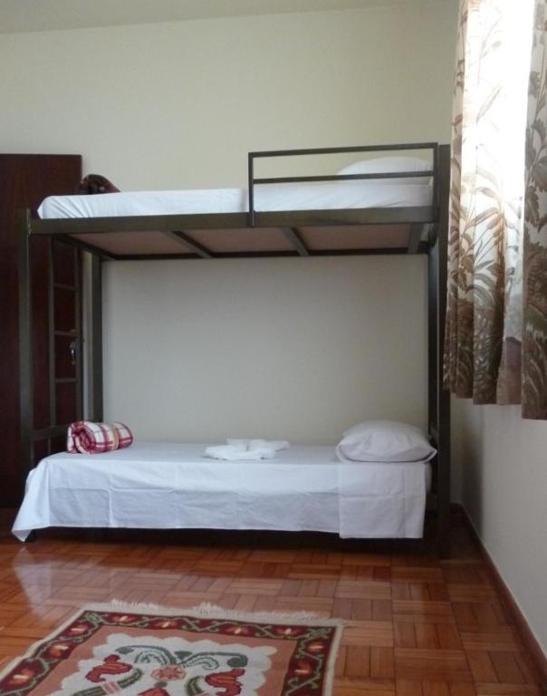 Postel nebo postele na pokoji v ubytování Hostel Casa Mineira