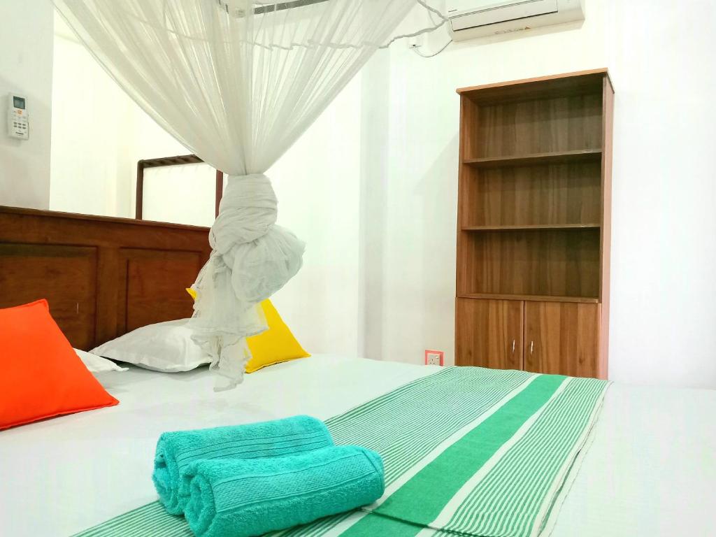 Postel nebo postele na pokoji v ubytování Sasagara Beach Villa
