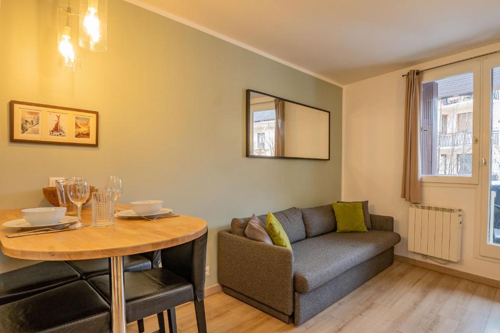 a living room with a couch and a table at Apartment Lognan 1 in Chamonix