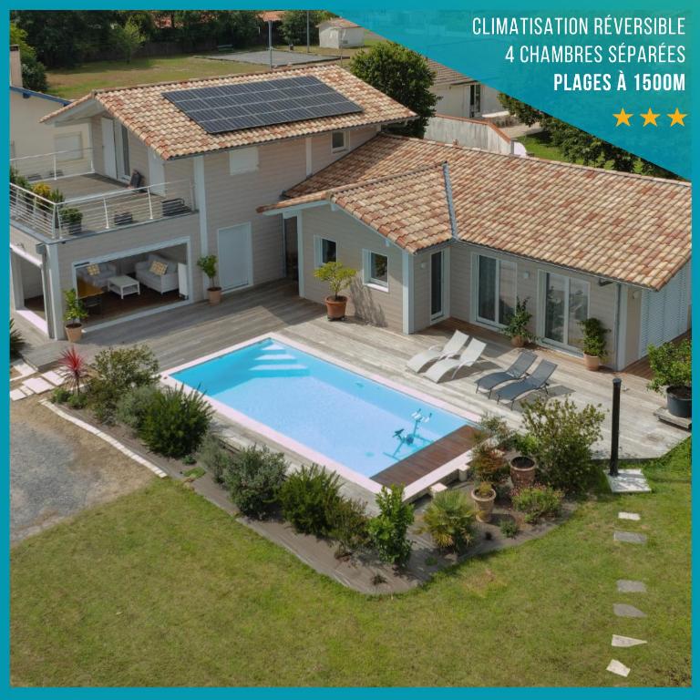 une image d'une maison avec piscine dans l'établissement Villa Uhaina Sérénité Océane, à Ondres