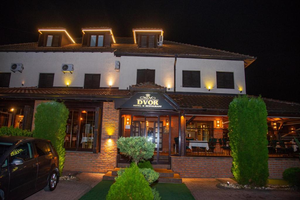 a building with a sign that reads the dower at Hotel Dvor in Bijelo Polje