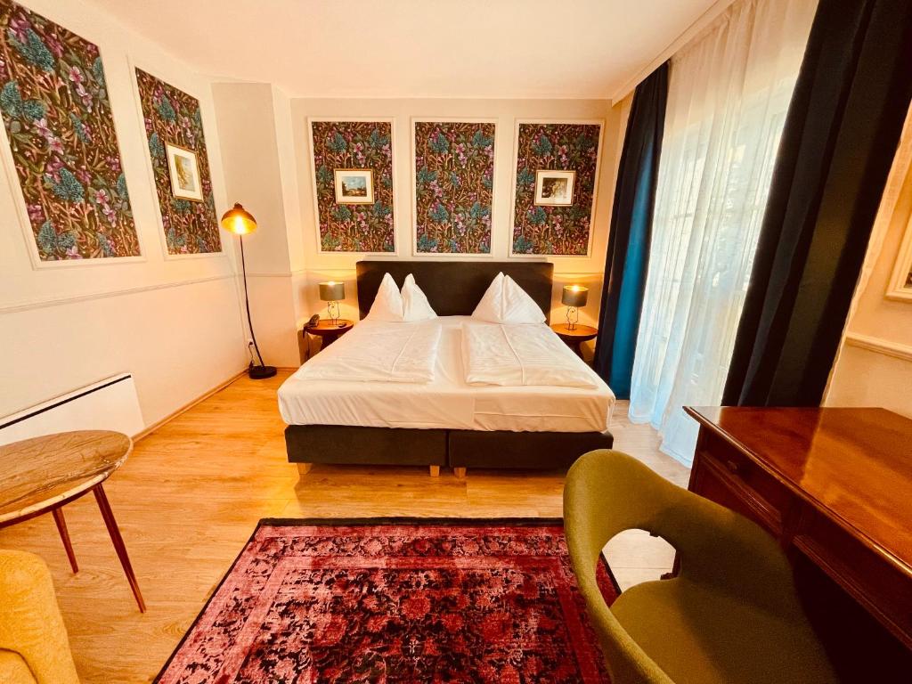 Postel nebo postele na pokoji v ubytování Gästehaus am Stadtpark