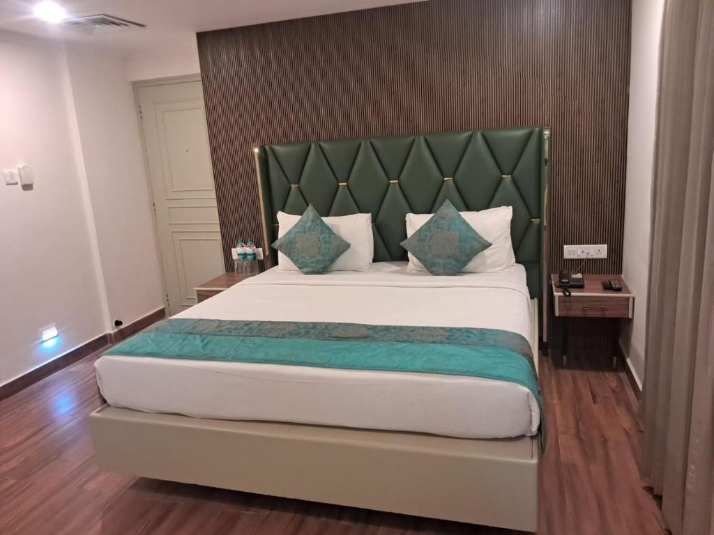 Postel nebo postele na pokoji v ubytování Hotel Grand Residence