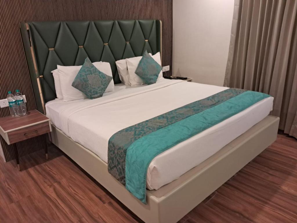 Postel nebo postele na pokoji v ubytování Hotel Grand Residence