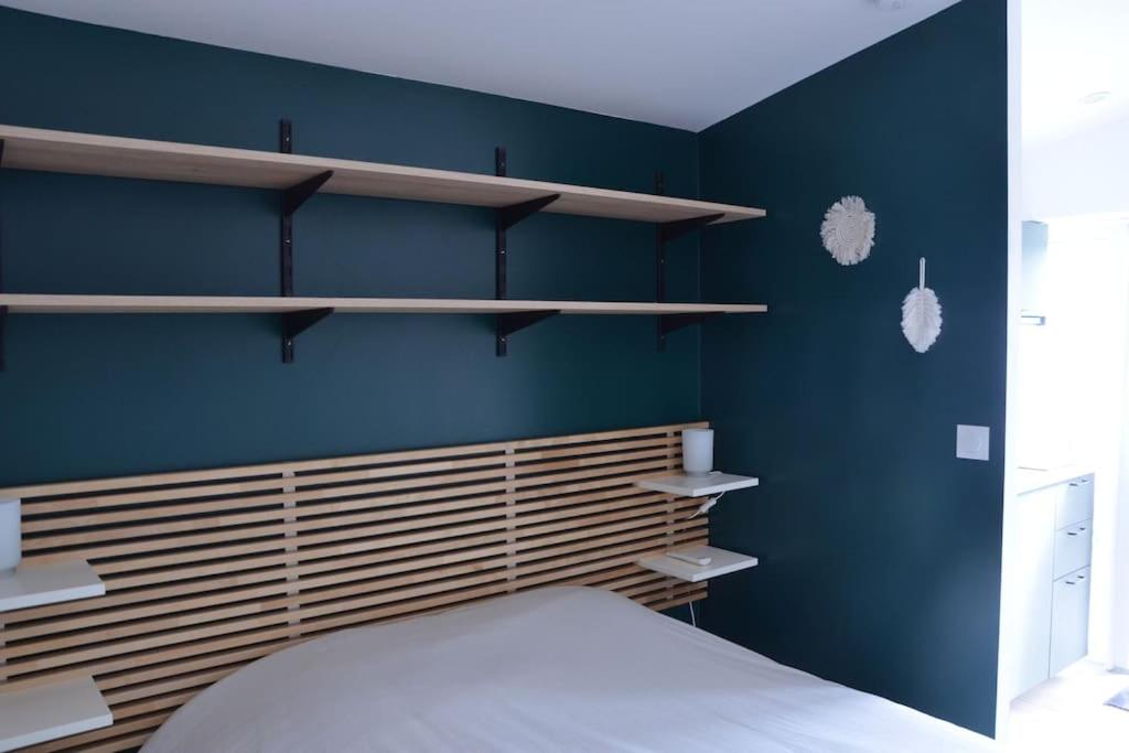 Ένα ή περισσότερα κρεβάτια σε δωμάτιο στο Studio confortable avec terrasse privée
