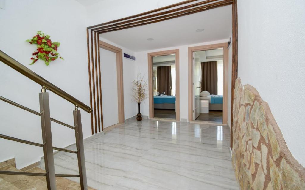 Postel nebo postele na pokoji v ubytování Esmeralda Butik Hotel