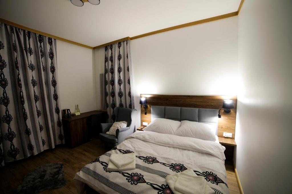 Postel nebo postele na pokoji v ubytování Willa Nosalowa Dolina