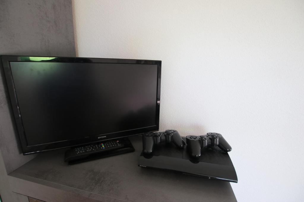 TV a/nebo společenská místnost v ubytování Ferienwohnung am Bärenstein