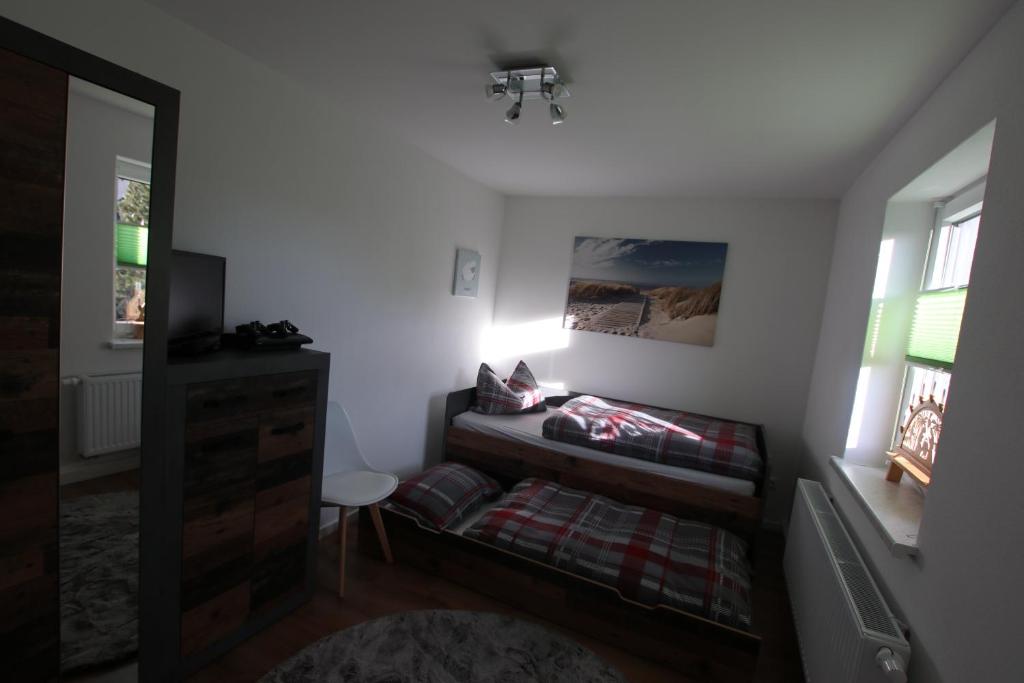 Postel nebo postele na pokoji v ubytování Ferienwohnung am Bärenstein
