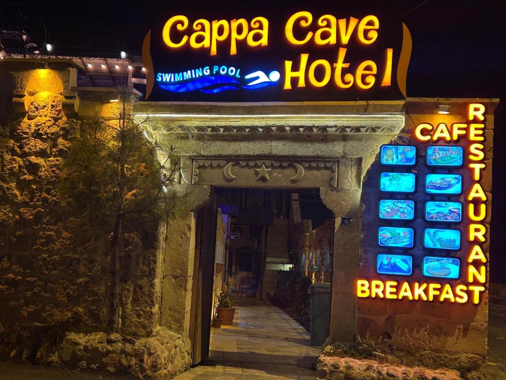 a sign for a carapa cave hotel at night at Cappa Cave Hotel in Goreme