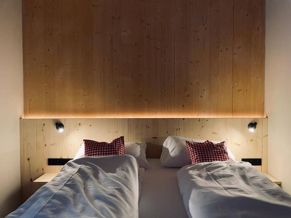 Voodi või voodid majutusasutuse Hideaway Planneralm operated by JUFA Hotels toas