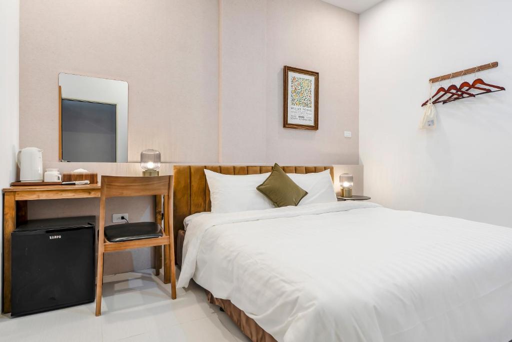 Postel nebo postele na pokoji v ubytování Sunset Mu Style Inn