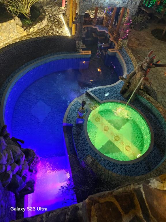 an overhead view of a swimming pool at a resort at Fort Mughaibar Resort in Hatta