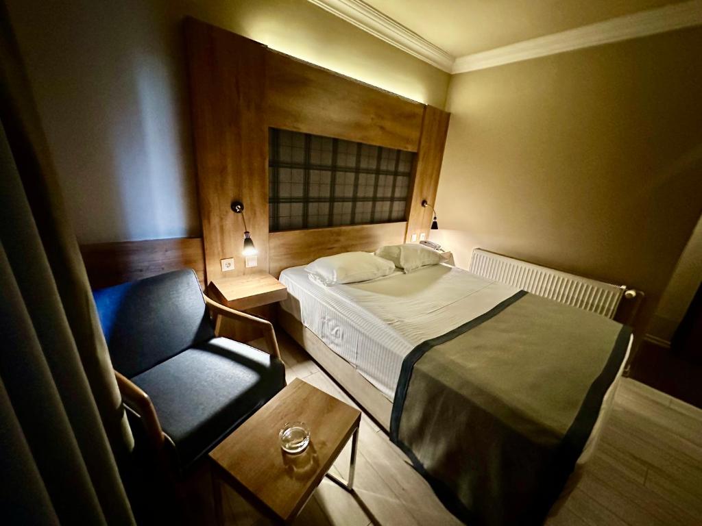 Postel nebo postele na pokoji v ubytování Laodikya Hotel