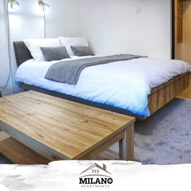 Postel nebo postele na pokoji v ubytování Milano Apartman ****