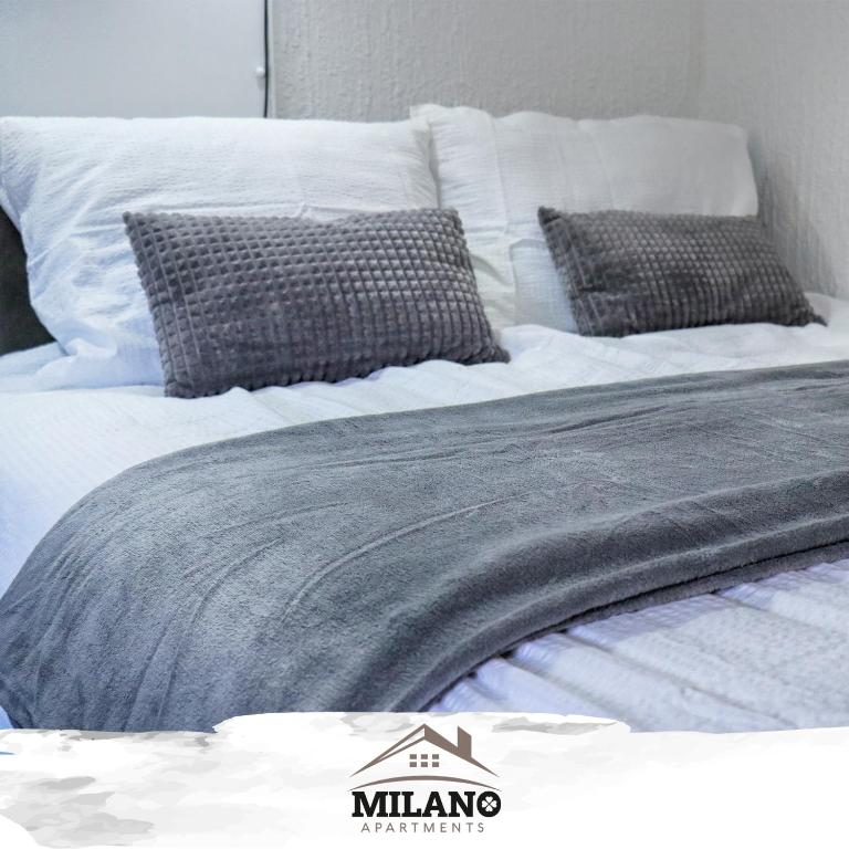 Postel nebo postele na pokoji v ubytování Milano Apartman ****