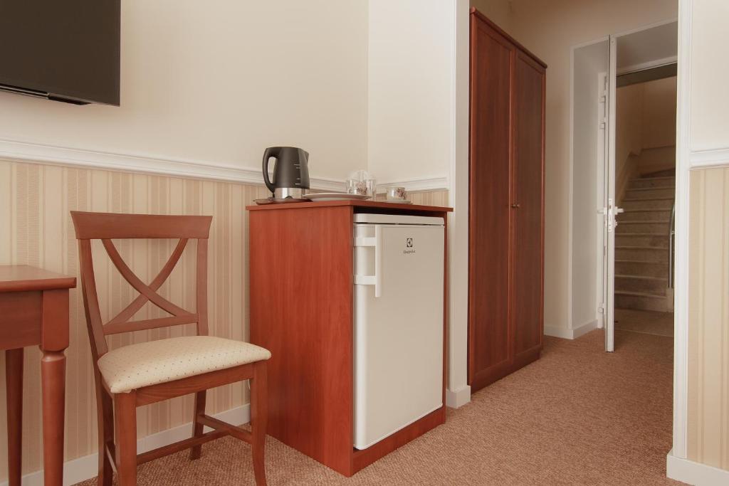 Kuchyň nebo kuchyňský kout v ubytování Consul Hotel Консул