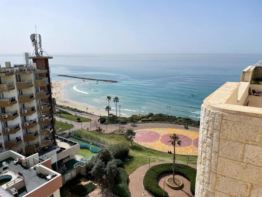 a view of the beach from a building at Beach house in Netanya