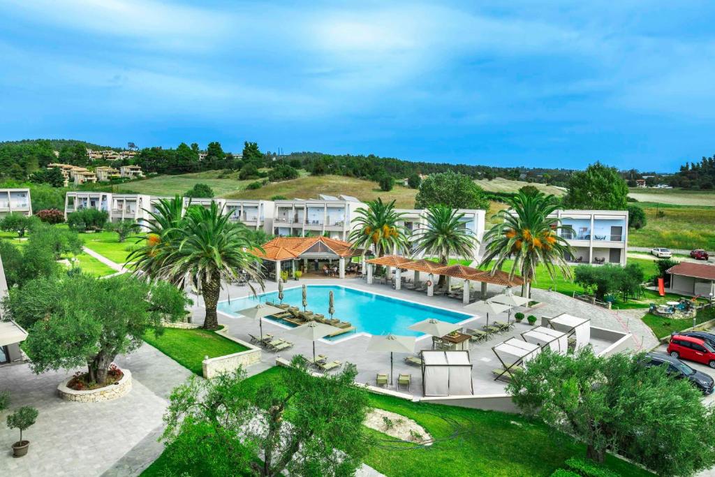 an aerial view of a resort with a pool at Iris Hotel in Siviri