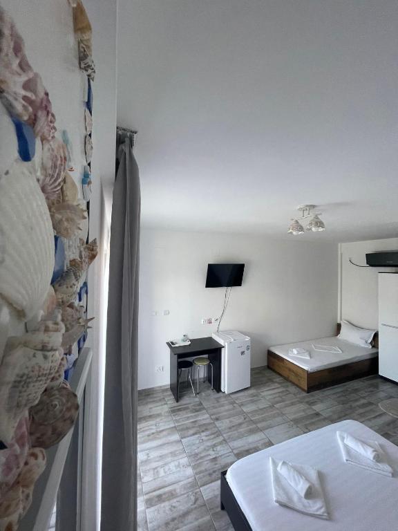 Postel nebo postele na pokoji v ubytování CASA SMARALD