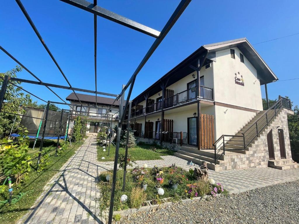 a house in the middle of a street at CASA SMARALD in Costinesti