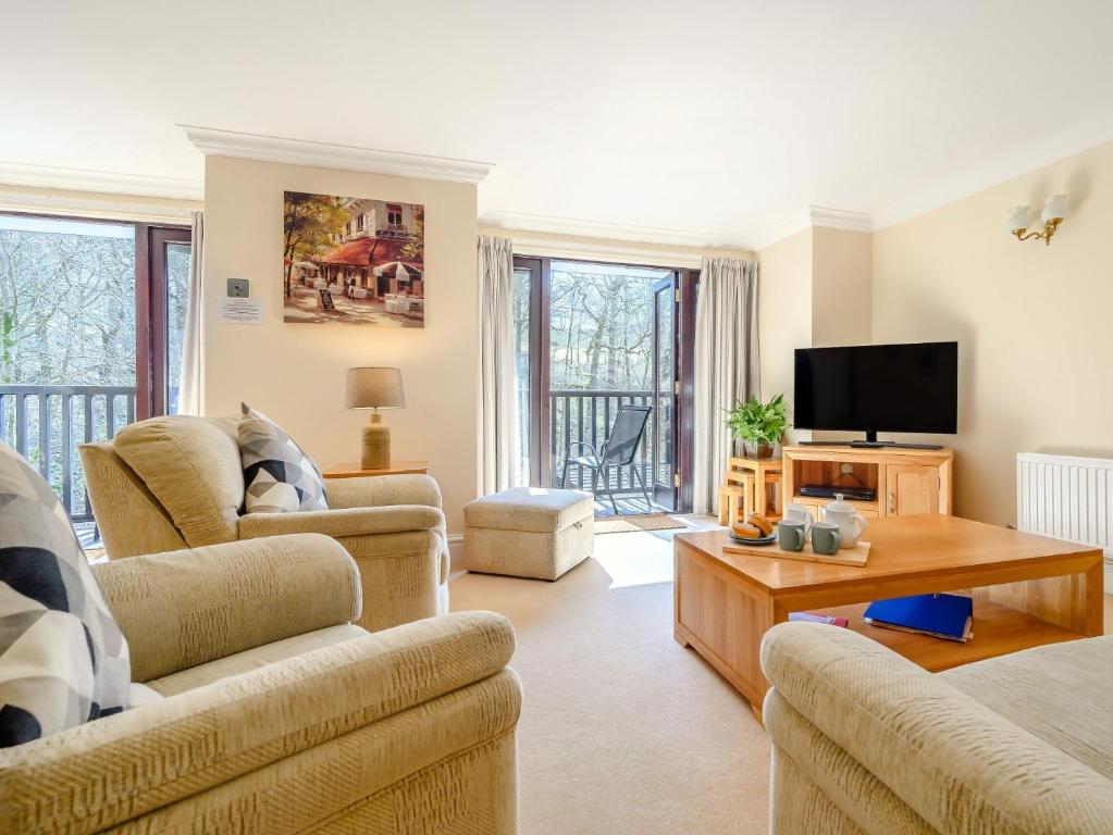 a living room with two couches and a tv at 3 Bed in Ambleside 87524 in Ambleside