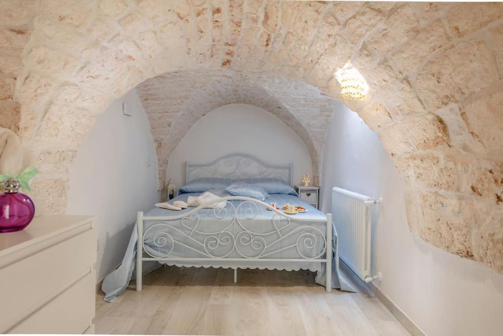 A bed or beds in a room at Le Alcove del Leopardi