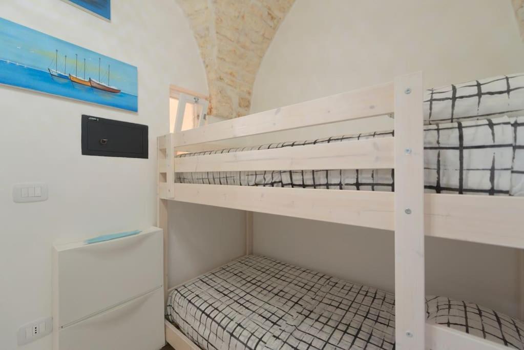 A bed or beds in a room at Le Alcove del Leopardi