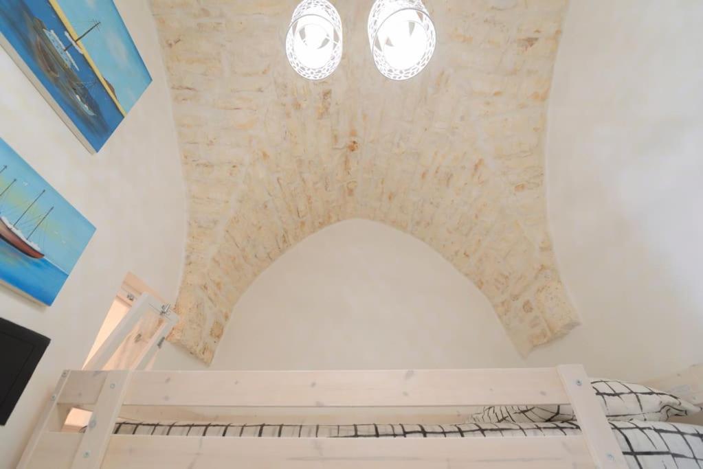 A bed or beds in a room at Le Alcove del Leopardi