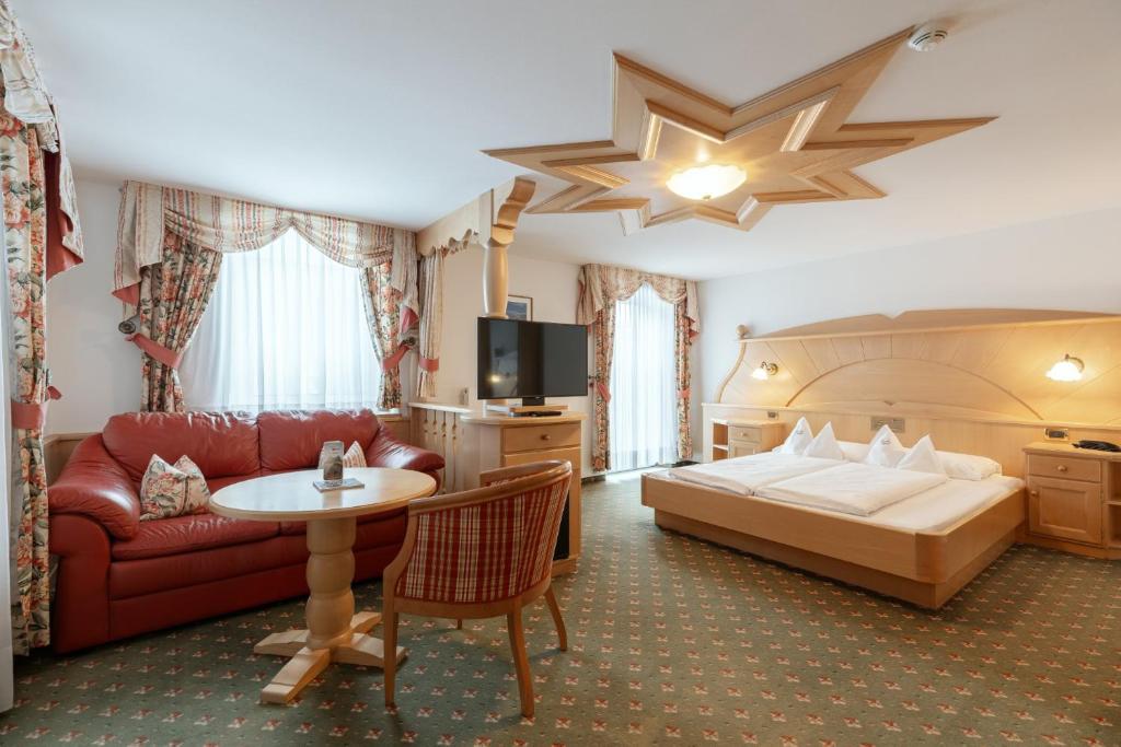 Postel nebo postele na pokoji v ubytování Piccolo Hotel