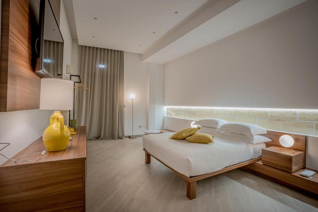 Postel nebo postele na pokoji v ubytování Tufo Bianco Relais