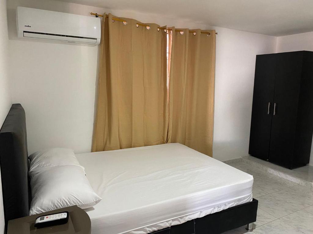 Postel nebo postele na pokoji v ubytování Piantini Houses