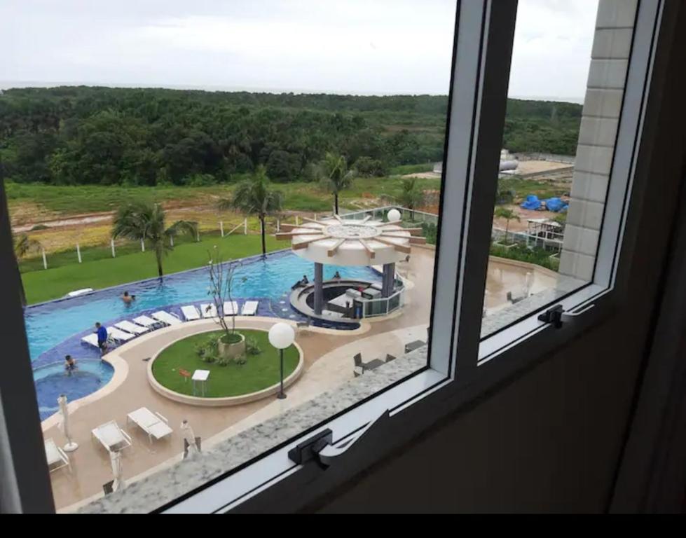 a view of a pool from a window at SALINAS PARCK in Salinópolis
