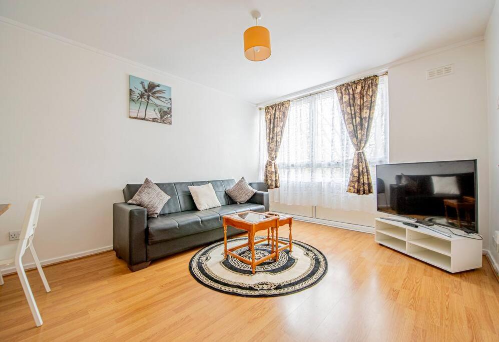 a living room with a couch and a table at Superb 2 bedroom Flat in the Heart of Marylebone in London