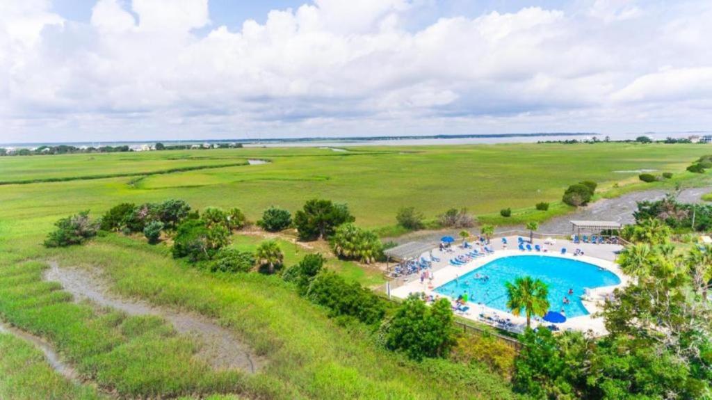 an overhead view of a swimming pool in a field at Direct Ocean View! M Building Pool and Ocean Views in Harbor Island