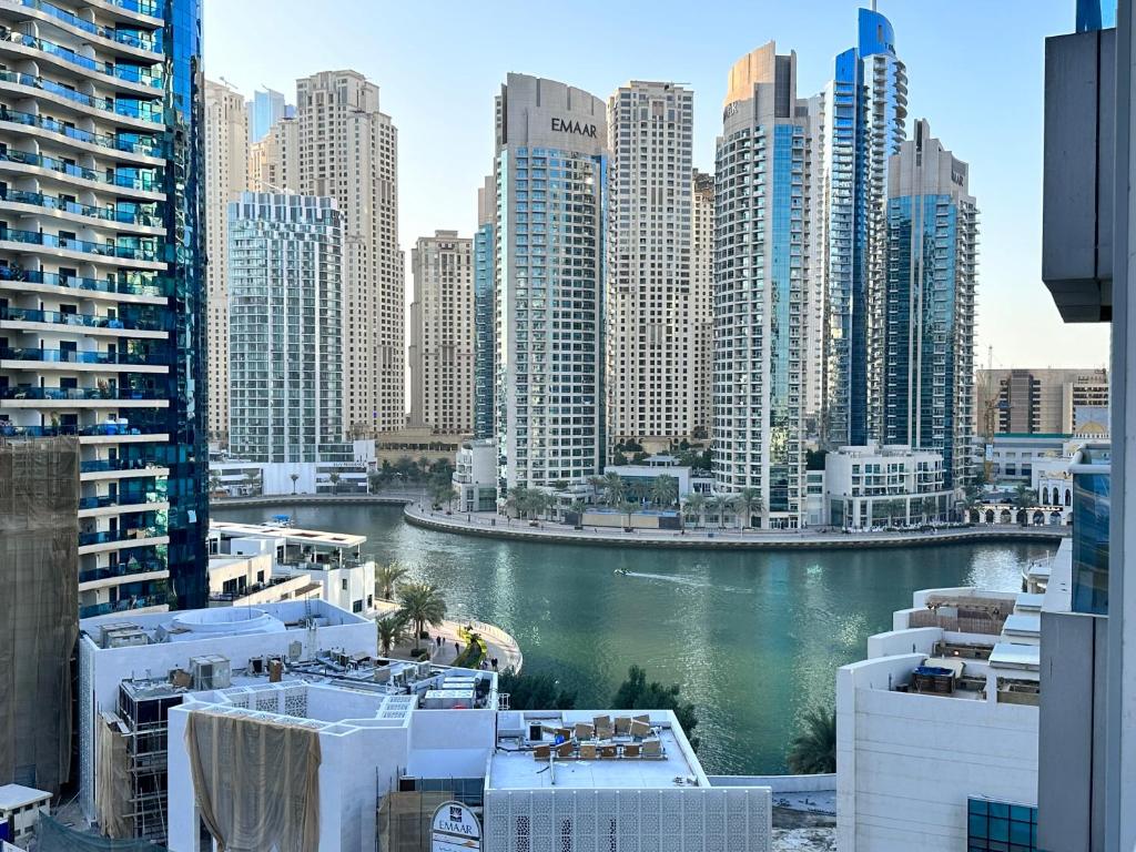 a view of a city with a river and buildings at Stay in heart of Dubai Marina walk to JBR beach in Dubai