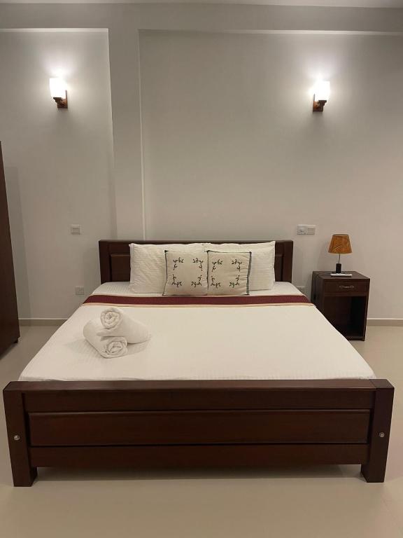Postel nebo postele na pokoji v ubytování Mihira Gedara Apartments