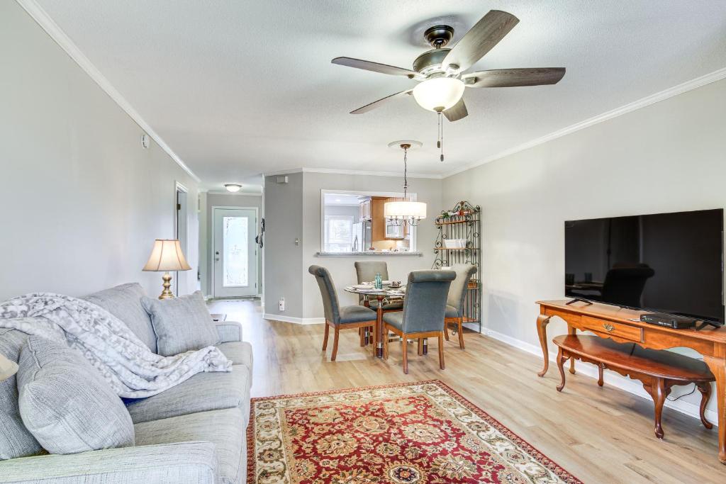 a living room with a couch and a table at Modern McCormick Townhome on Lake Thurmond! in McCormick