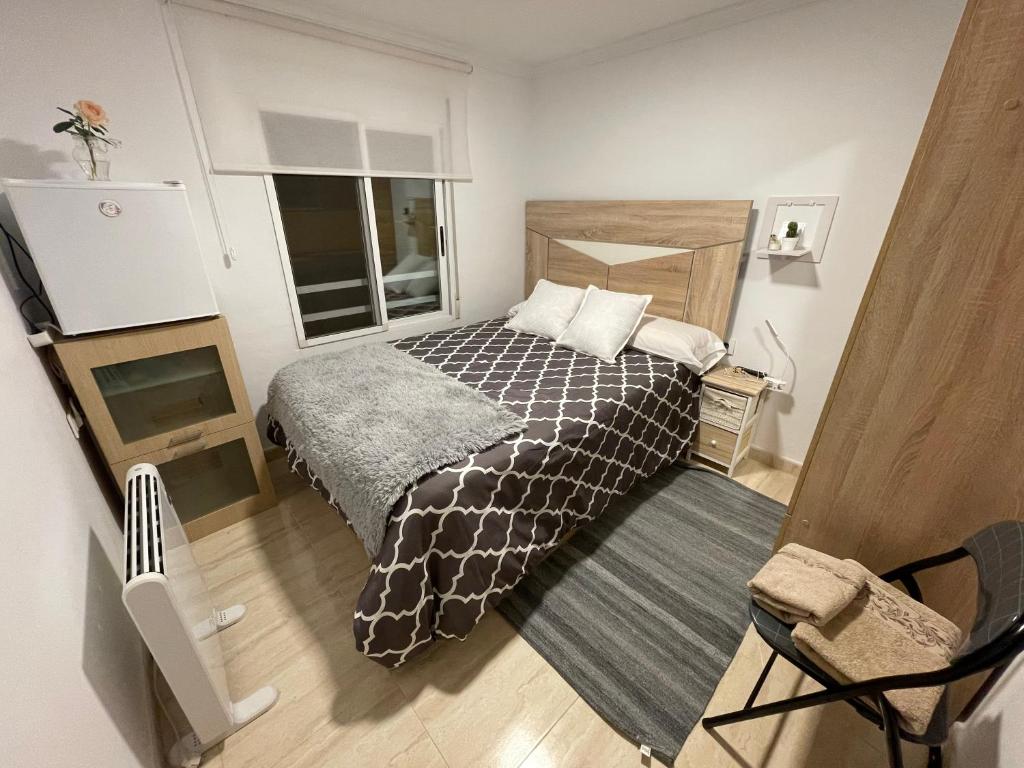 A bed or beds in a room at El Patio de Lucy